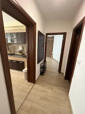 a hallway leading to a kitchen with a floor at Panorama View Belgrade in Belgrade