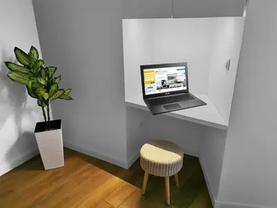 a laptop computer sitting on a shelf in a room at Viktor Luxury Suites in Belgrade