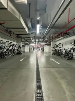 a parking garage filled with lots of bikes at Hedonia in Belgrade