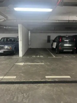 two cars are parked in a parking garage at Hedonia in Belgrade