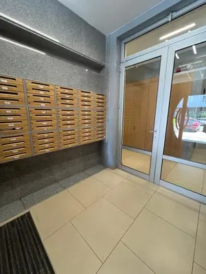 a room with wooden shutters on a wall at Hedonia in Belgrade