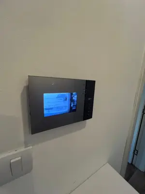 a flat screen tv hanging on a wall at LUX Apartment A&M Netflix in Belgrade
