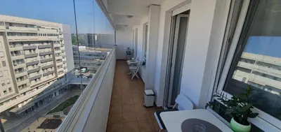 an apartment balcony with a view of a building at Royal apartment Belvill in Belgrade