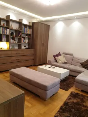 a living room with a couch and a coffee table at Metropol Lux apartment Belgrade Vracar in Belgrade