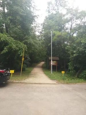 a dirt road with signs on the side of the road at Vlado apartment VS in Belgrade