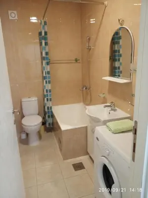 a bathroom with a toilet and a sink and a shower at Vlado apartment VS in Belgrade