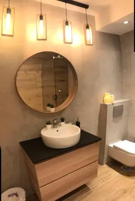 a bathroom with a sink and a mirror and a toilet at Vracar Apartment in Belgrade