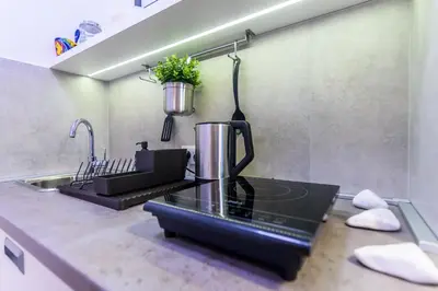 a kitchen with a coffee maker on a counter at Vracar Apartment in Belgrade