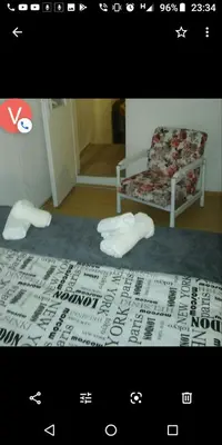 a picture of a bedroom with a chair and a bed at Gardos dupleks in Belgrade