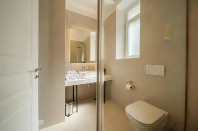 a bathroom with a toilet and a sink at Slavija Fontana Lux Apartments in Belgrade