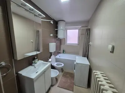 a bathroom with a sink and a toilet and a tub at Authentic Belgrade Centre Apartment #2, Four Bedrooms, One full Bathroom, One Toilet in Belgrade