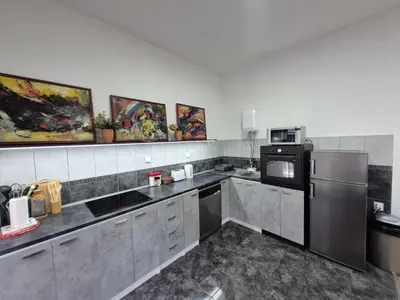 a kitchen with a refrigerator and a microwave at Authentic Belgrade Centre Apartment #2, Four Bedrooms, One full Bathroom, One Toilet in Belgrade
