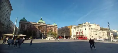 a group of people walking around a city square at Authentic Belgrade Centre Apartment #2, Four Bedrooms, One full Bathroom, One Toilet in Belgrade