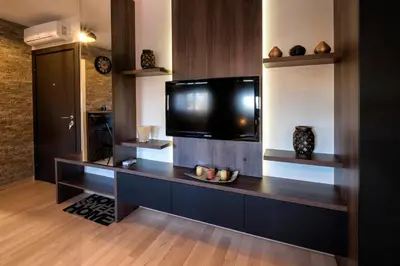 a living room with a flat screen tv on a wall at Apartment Story,Nikole Cupica Beograd in Belgrade