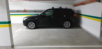 a black car is parked in a garage at Apartment Story,Nikole Cupica Beograd in Belgrade
