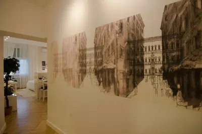 a wall with a painting of a building on it at Studio Stil in Belgrade