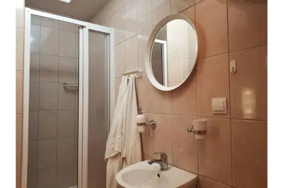 a bathroom with a sink and a mirror at Bella Centre Apartment in Belgrade