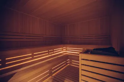 an empty sauna with lights on the inside of it at Hotel Mona Plaza in Belgrade