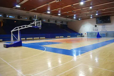 an empty gymnasium with a basketball court with a net at Apartment De Luna Belgrade in Belgrade