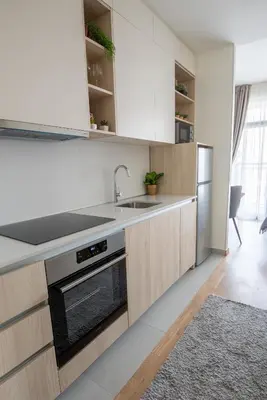 a kitchen with a sink and a stove at Belgrade Waterfront GREEN Apartment in Belgrade