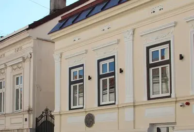 a white building with windows on the side of it at Urban Lodge Belgrade in Belgrade