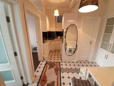 a small hallway with a mirror and a room at Belgrade Center Apartment Slavija Square III in Belgrade