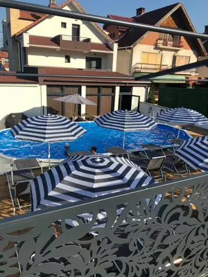 a group of blue and white umbrellas on a patio at Luxury Apartments 88 in Smederevo