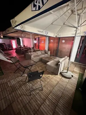 a living room with couches and a table at Luxury Apartments 88 in Smederevo