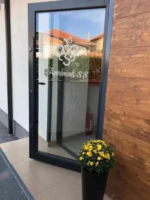 a glass door with a pot of flowers in front of it at Luxury Apartments 88 in Smederevo