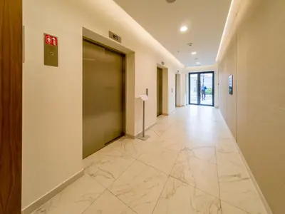 a hallway with a large door in a building at Apartment Rebecca in Belgrade