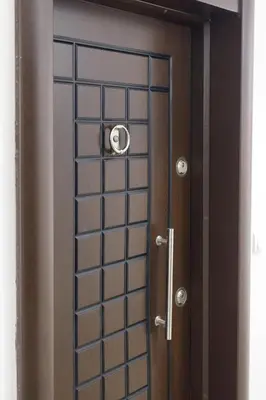 a glass door with a metal grid on it at Apartman Niki in Arandjelovac