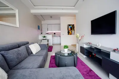 a living room with a couch and a tv at Apartman Niki in Arandjelovac