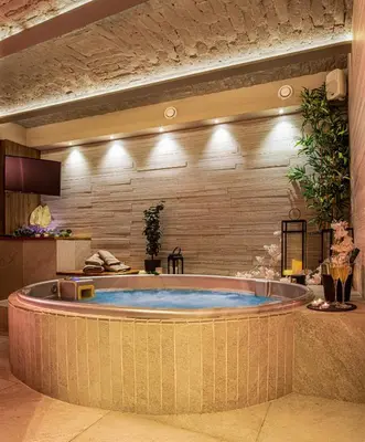 a jacuzzi tub in a hotel room at VENUS Apartment with jacuzzi and sauna - City Center in Belgrade