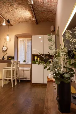 a kitchen with a table and a vase with a plant at VENUS Apartment with jacuzzi and sauna - City Center in Belgrade