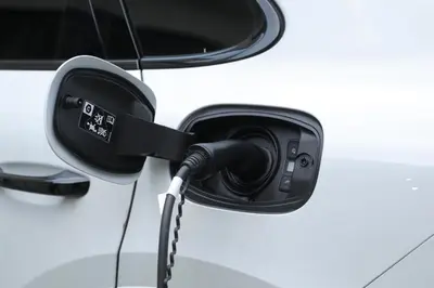 a car with a charging cord attached to it at Nobel Gallery Hotel in Belgrade