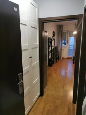 a door leading into a room with a hallway at Charlie Aviv Park in Belgrade