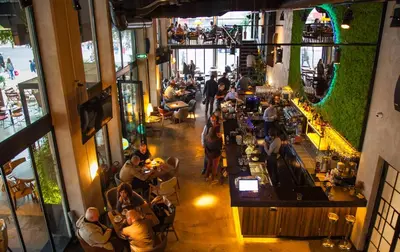 an overhead view of a restaurant with people sitting at tables at Teanna Lux Apartments in Belgrade