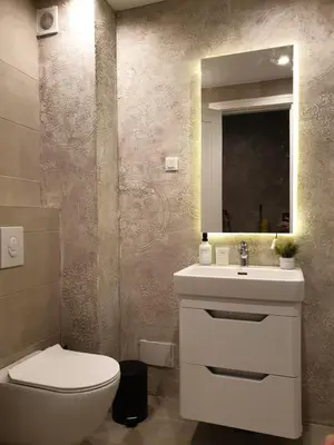 a bathroom with a toilet and a sink and a mirror at Luxury Spa Suite in Belgrade