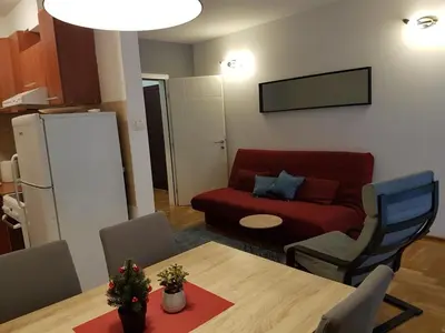 a living room with a couch and a table at Luka Lux apartman in Belgrade