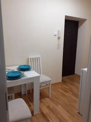 a white table with two blue plates on it at Apartment Marija in Belgrade