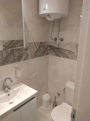 a bathroom with a sink and a toilet at Alba Graeca in Belgrade