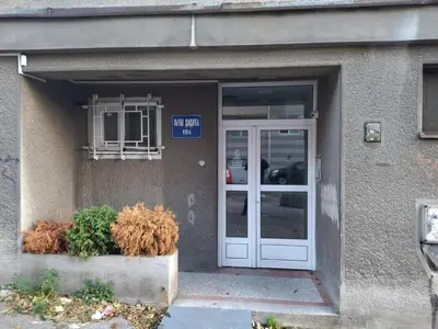 a building with a door and a sign on it at Castel Bianco in Belgrade