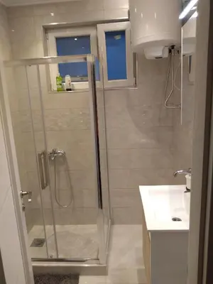 a bathroom with a shower and a sink at Castel Bianco in Belgrade