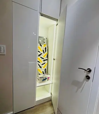 a door to a closet with a drawer filled with shoes at LIRRA LUXE - Central Belgrade Apartments in Belgrade