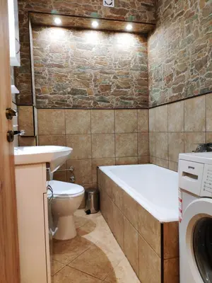 a bathroom with a tub and a toilet and a sink at V2 with Love - Vintage Modern and Spacious in Belgrade
