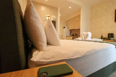 a bedroom with a bed with pillows on it at Apartments Royal - Belgrade Waterfront in Belgrade