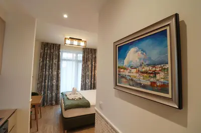 a room with a painting hanging on the wall at Apartments Royal - Belgrade Waterfront in Belgrade