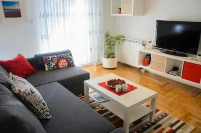 a living room with a couch and a coffee table at Dunavski Kej in Smederevo
