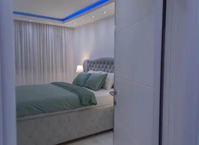 a bedroom with a bed with a blue ceiling at Apartment 