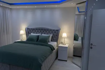 a bedroom with a bed with a blue ceiling at Apartment 